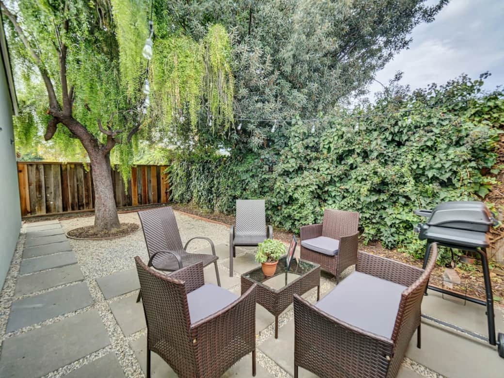 Spend your evenings relaxing on the patio, surrounded by lush greenery. 