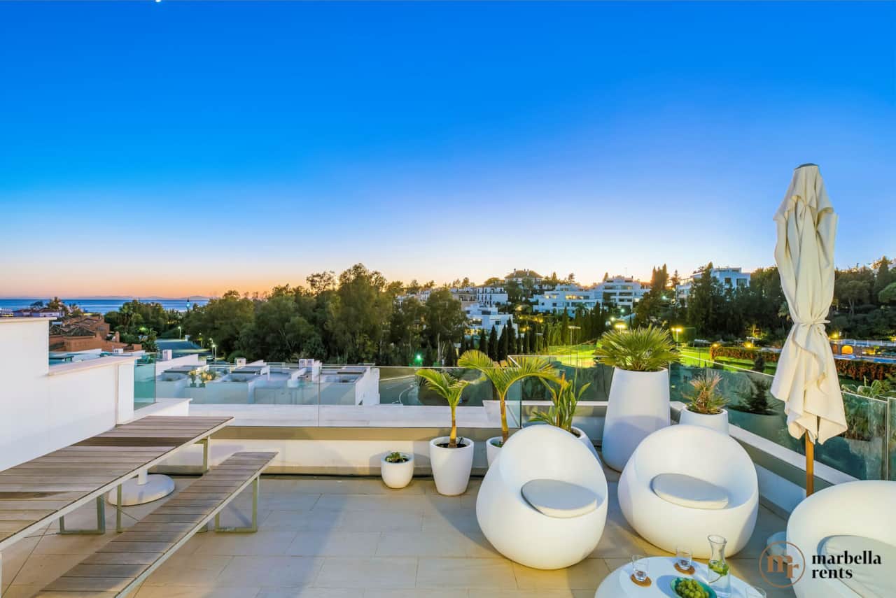 Outdoor lounge with sea view.