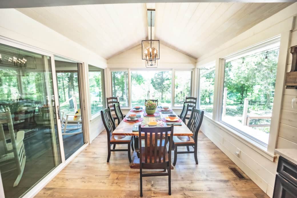 The handmade table anchors the dining room. Easy access to the screened-in porch is on the left. The handmade table anchors the dining room. Easy access to the screened-in porch is on the left.