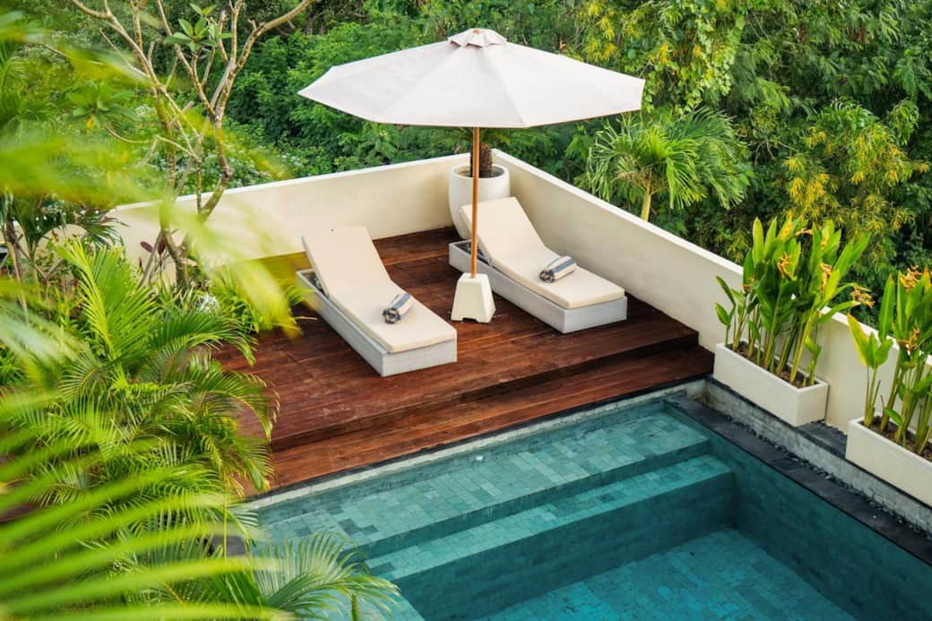Your private sun deck escape – perfect for sunbathing or napping in the shade of the parasol right next to the pool.