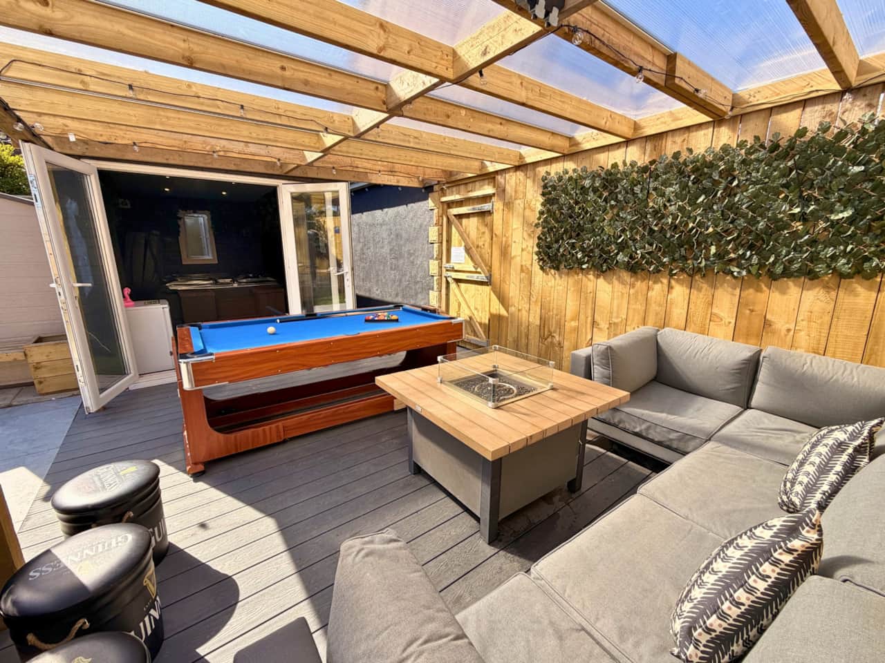 All weather seating area + pool table + hot tub room