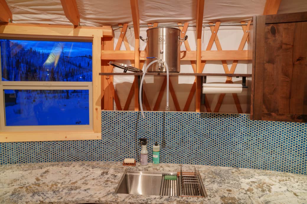 Gravity-fed water system with sink