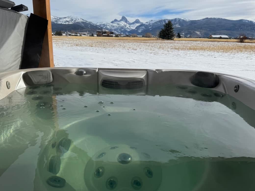Jacuzzi hot tub under large gazebo for year round use.