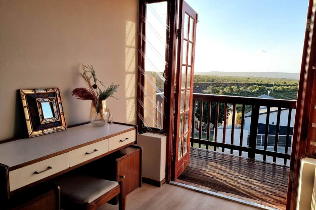 Bedroom upstairs has it's own private balcony with panoramic views of the mountains in the distance