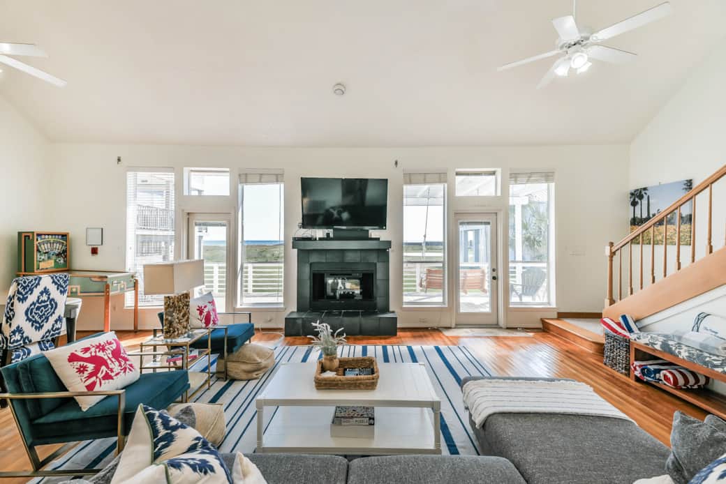 The living room features flat-screen TV and fireplace as well as plenty of comfortable seating. The living room features flat-screen TV and fireplace as well as plenty of comfortable seating.