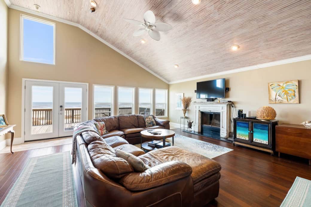 Family room features a wall of windows providing stunning ocean views.