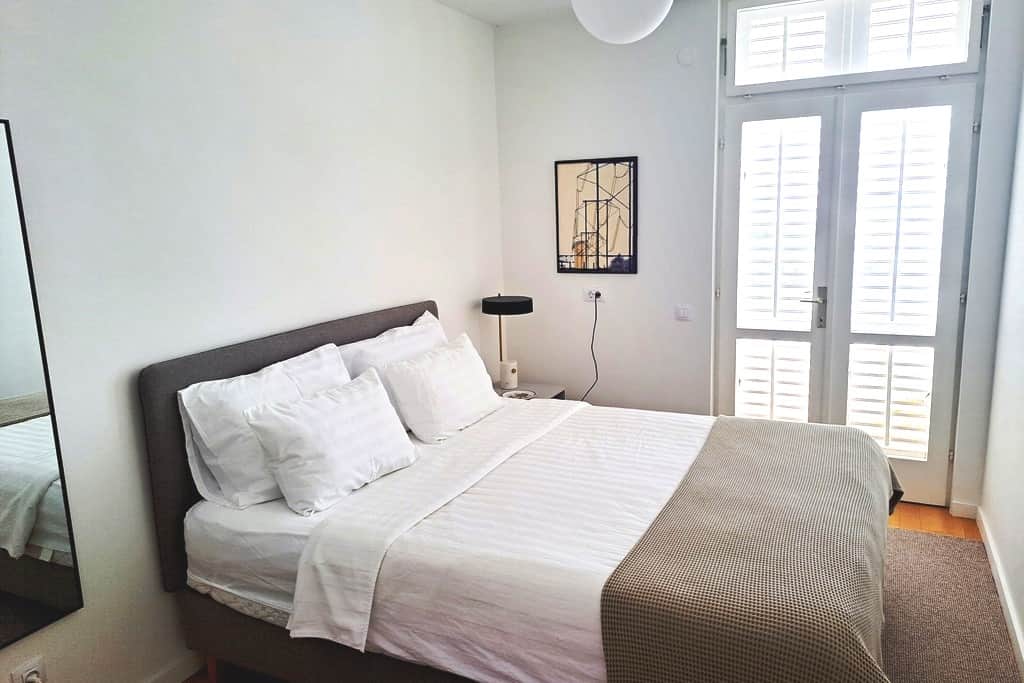 The flooring in both bedrooms is solid Croatian oak, with soft carpeting underfoot around the beds.