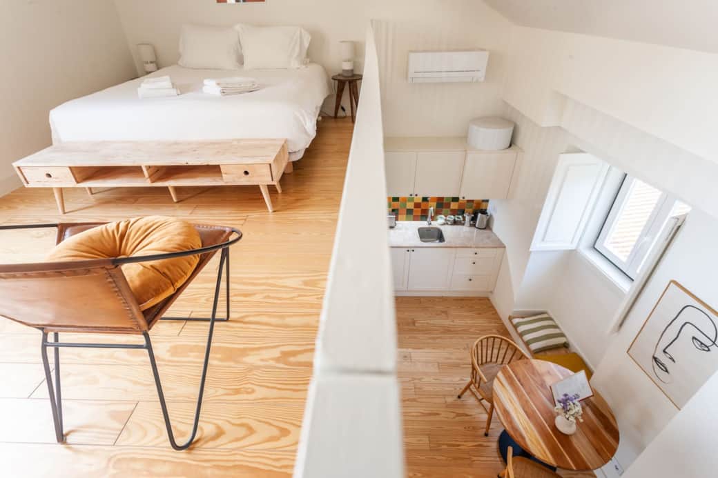 The living spaces are divided into 3 distinct areas: 
- the kitchen / dinning area
- the mezzanine, functions both as a second bedroom and lounge area
- the rooftop terrace