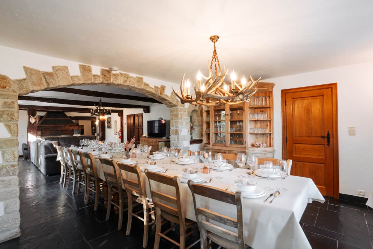 Dining room with a long table set for a group