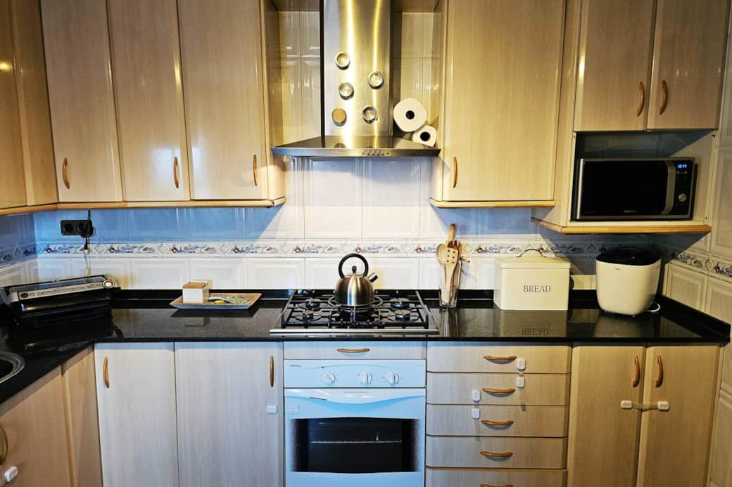 The kitchenette includes a gas stove, electric oven, microwave and full-contact grill.