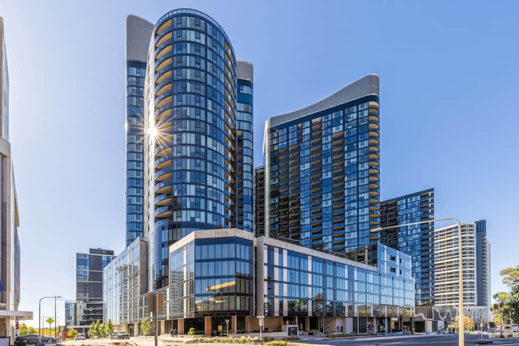 The building's exterior showcases modern architecture with sleek lines and expansive glass windows. Its prominent location and attractive design make it a standout in the city skyline, offering guests a sense of urban luxury and convenience.
