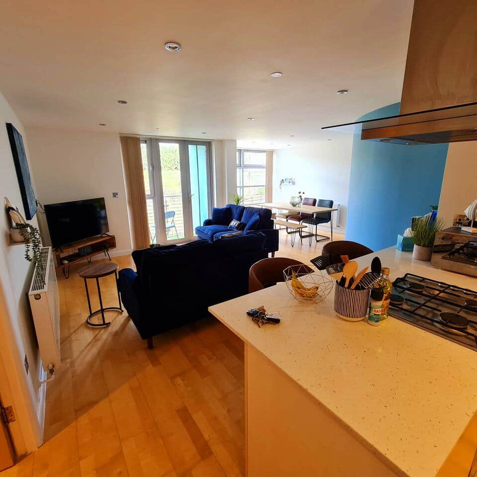 Large dining space with fully equipped kitchen and comfy sofas to watch the 50" smart TV