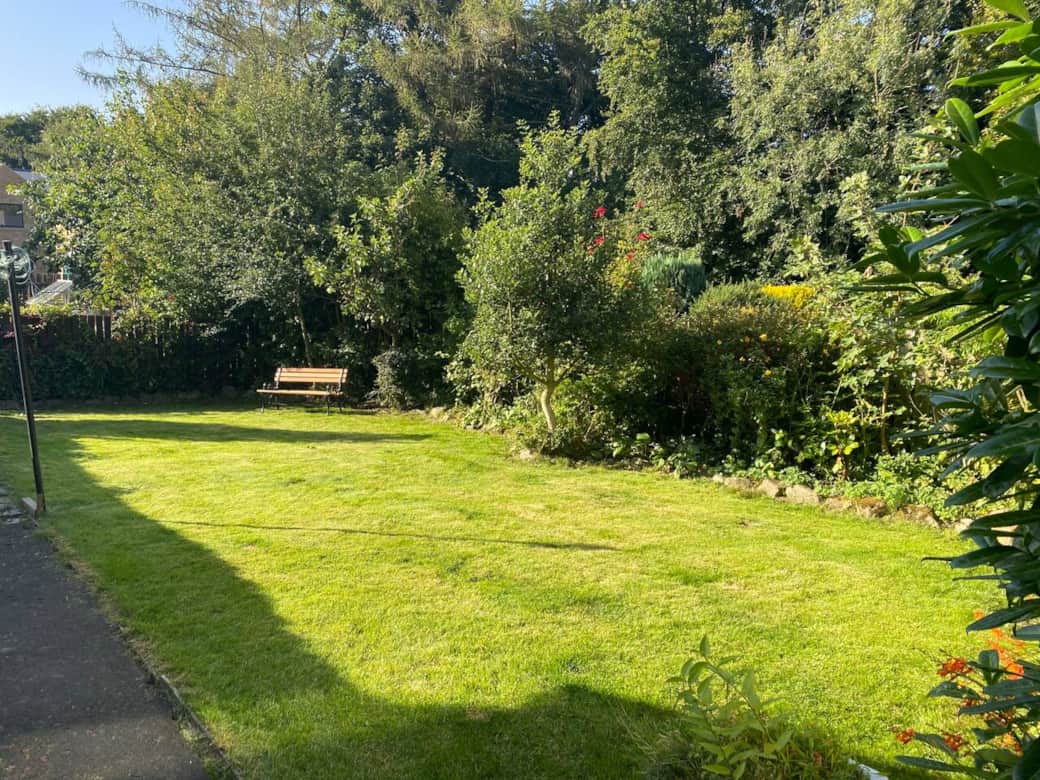 Rear enclosed mature garden with seating