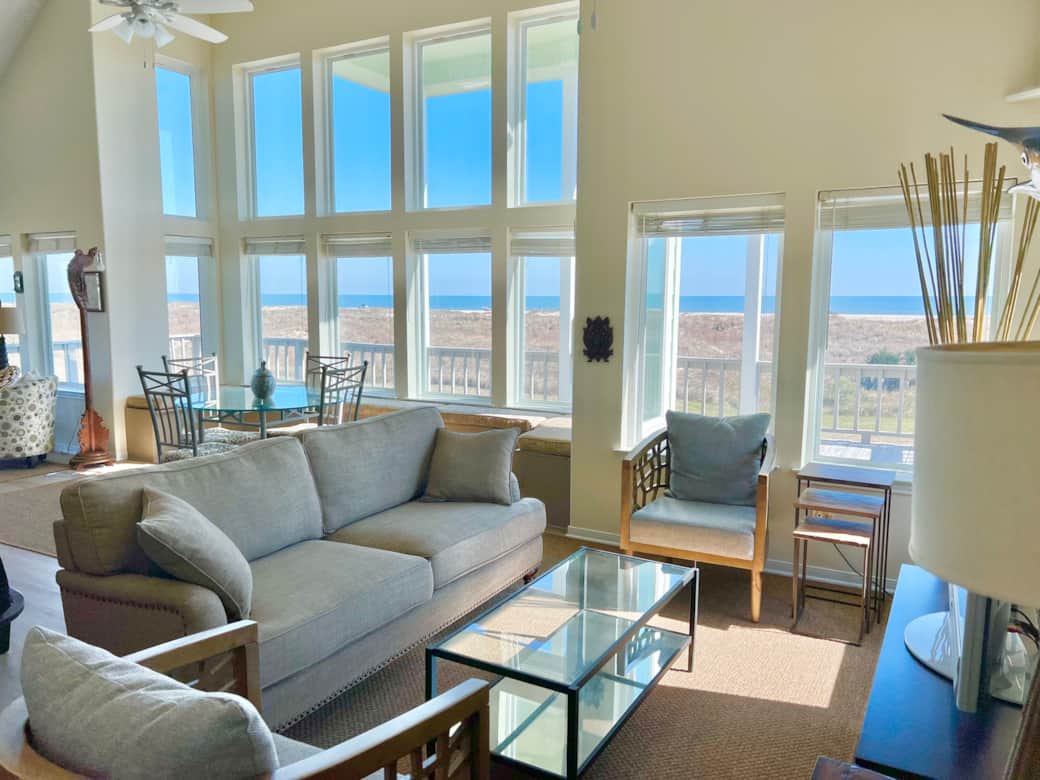 The home has huge windows which showcase the incredible view of the beach and dunes. The home has huge windows which showcase the incredible view of the beach and dunes.