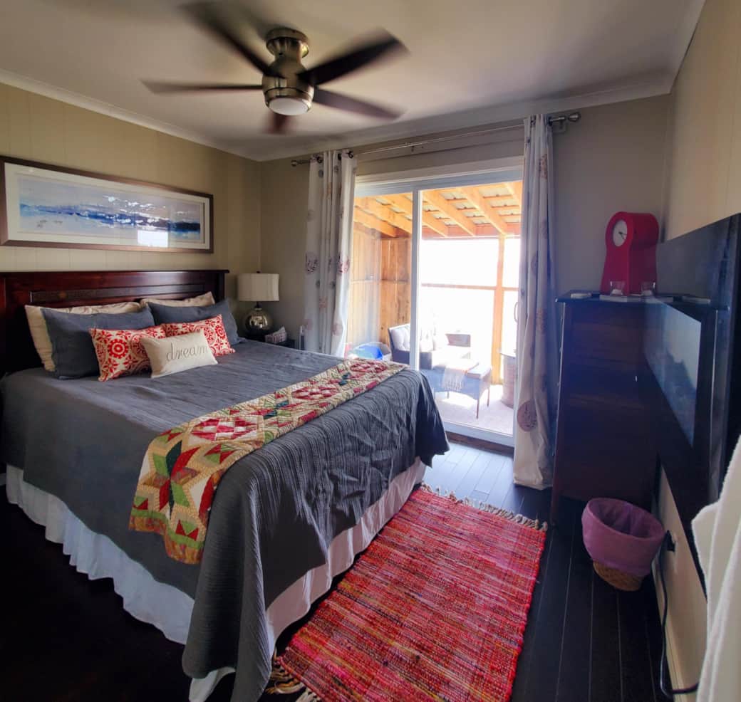 Queen Master bedroom with walk out to sunroom Queen Master bedroom with walk out to sunroom