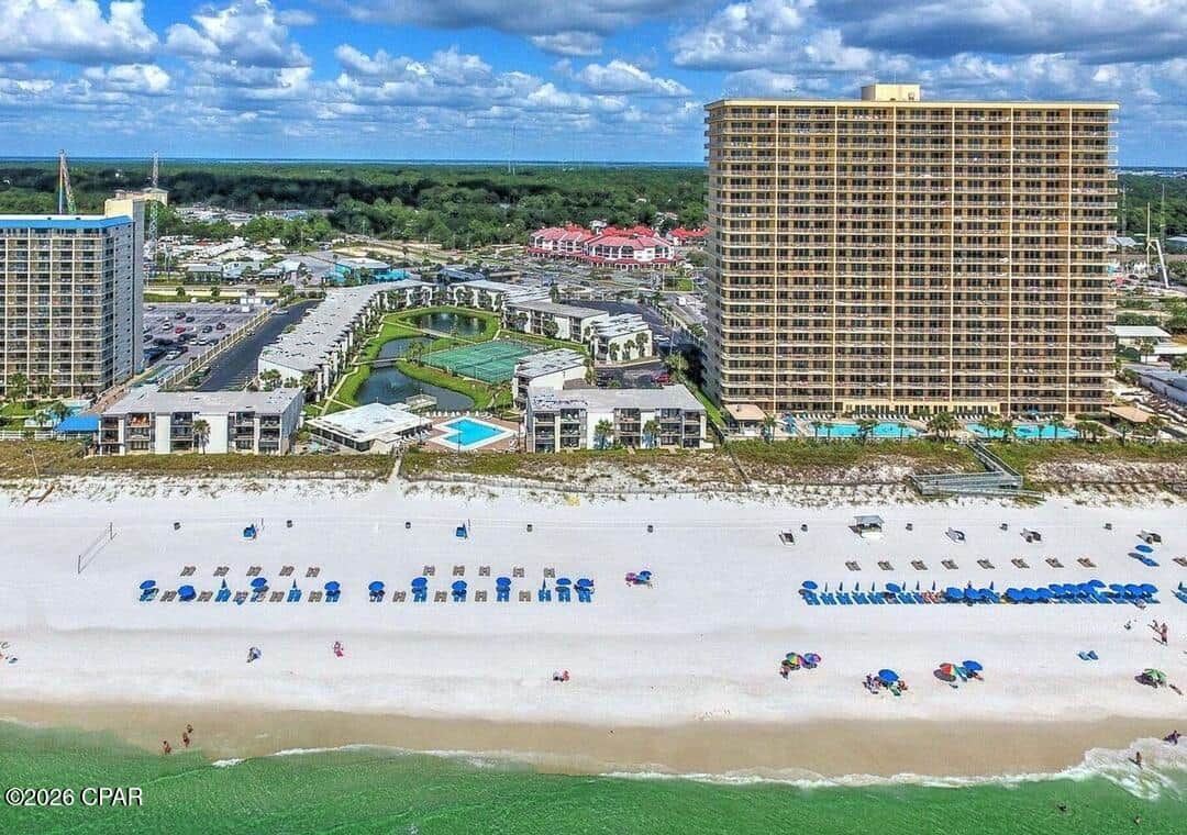 Aerial of complex with less beach density than the towers next to us