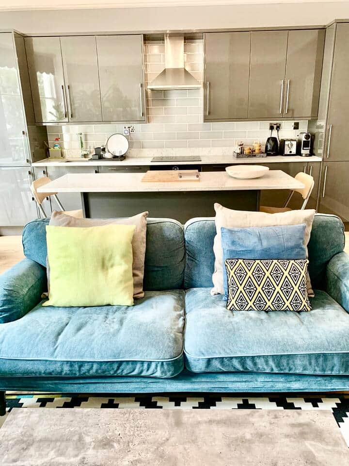 Living Room: The open-plan kitchen/living area is bathed in natural light