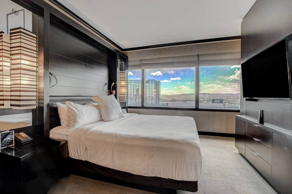 King Bed Facing Expansive Aria Skyline Windows