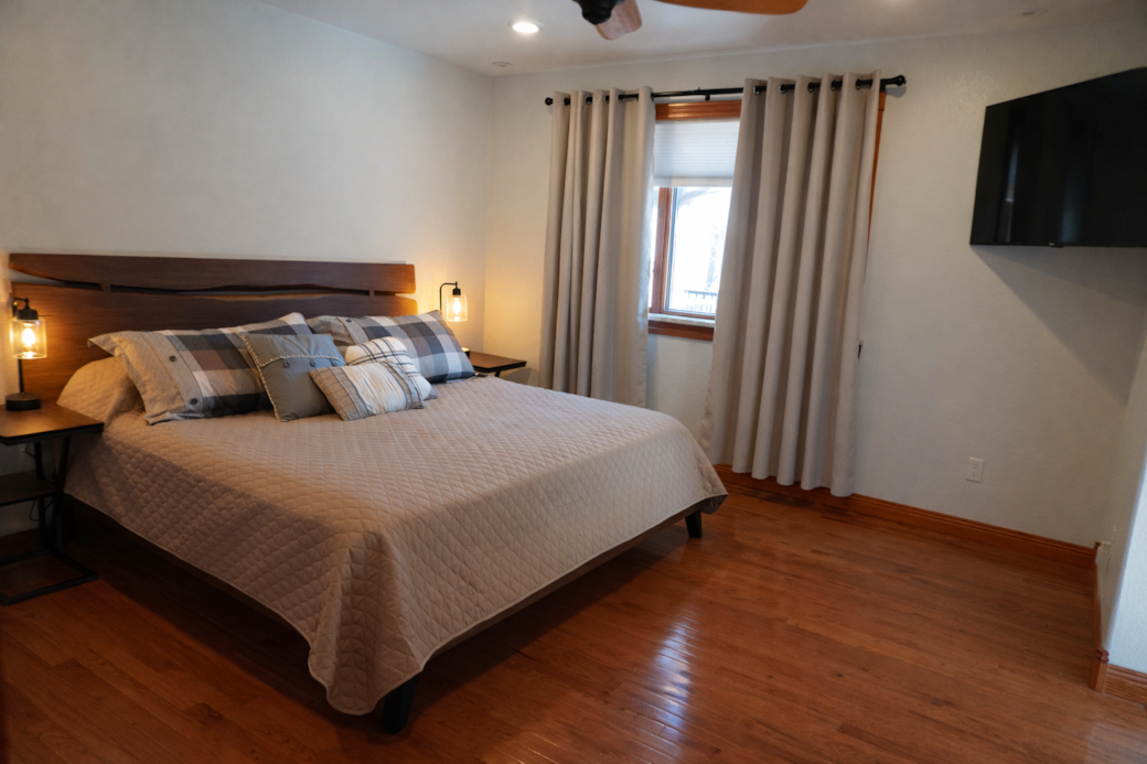 Primary suite with comfortable king bed for restful sleep. Primary suite with comfortable king bed for restful sleep.