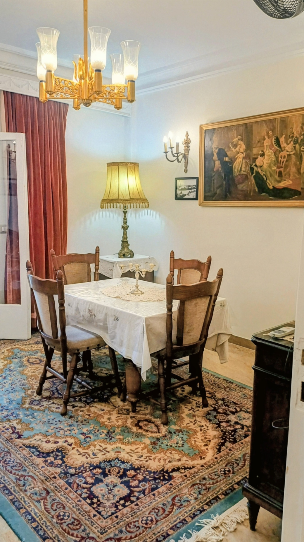 Bright, vintage dining room with character — comfortable table for four persons.