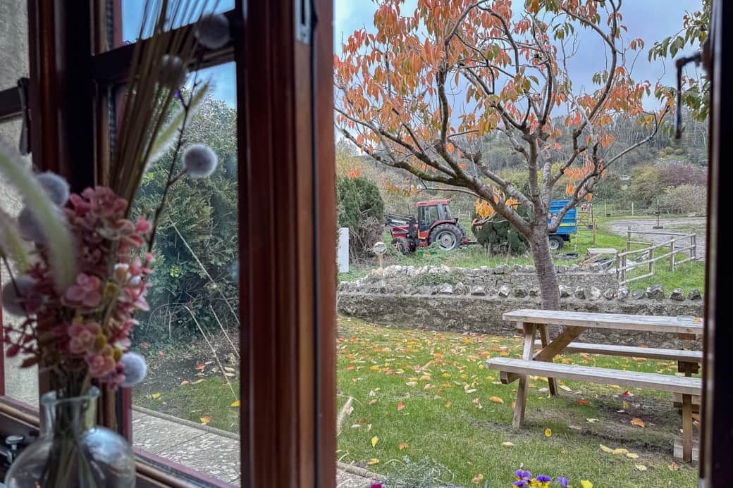 View out the living room window into the garden. stables over the road. View out the living room window into the garden. stables over the road.