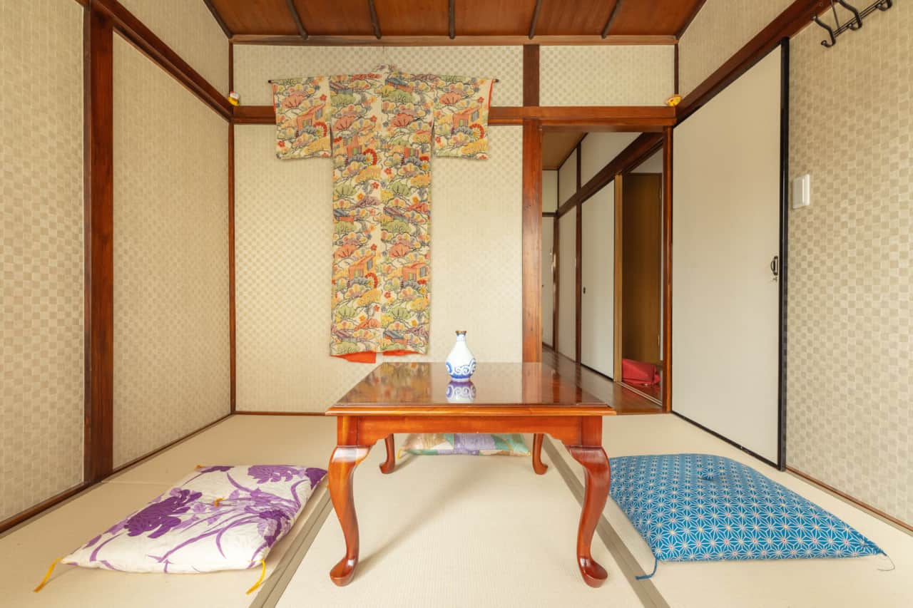 Soak in the serenity of this classic tatami room, with elegant kimono art