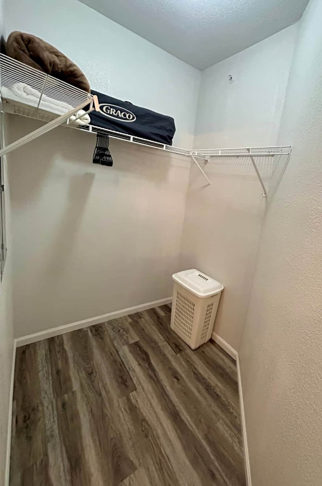 Walk-in Closet with extra blankets and pack and play in Primary Room Walk-in Closet with extra blankets and pack and play in Primary Room