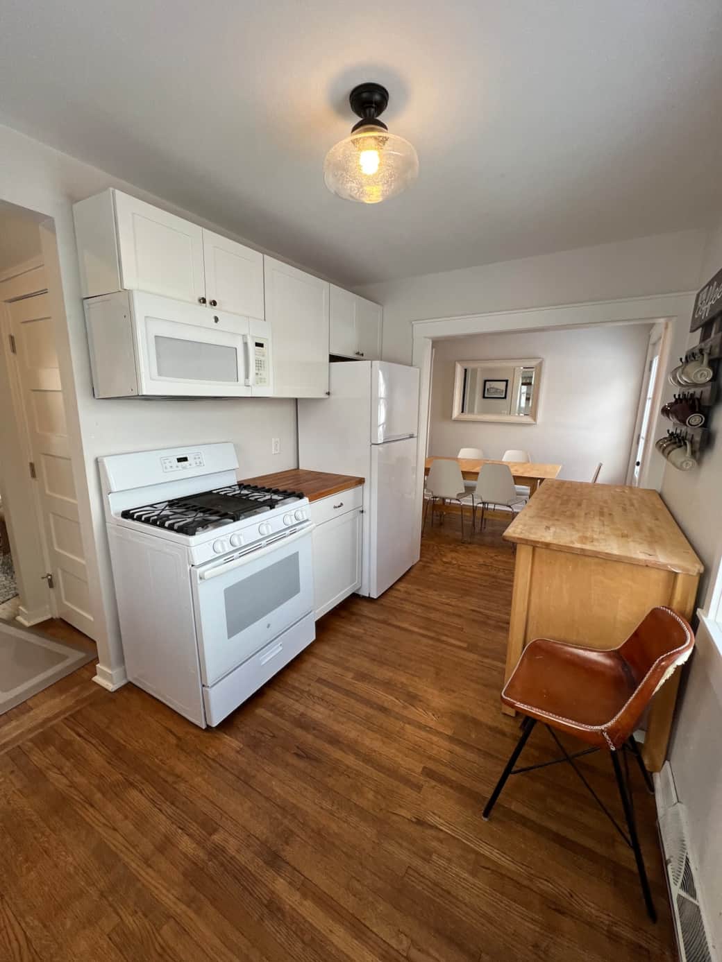 Kitchen furnished with dishwasher, gas stove, full height fridge/freezer, electric tea kettler, keurig and microwave