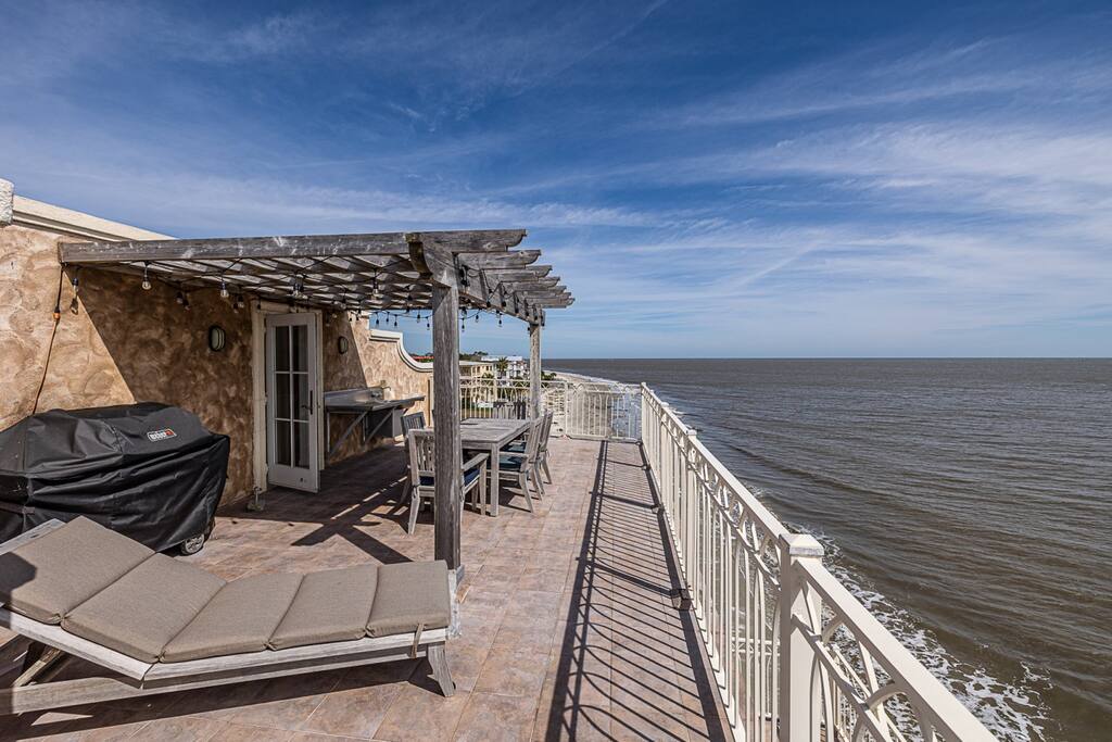 Rooftop with dining, gas grill, lounge chair and sink/prep area.  Views are amazing!