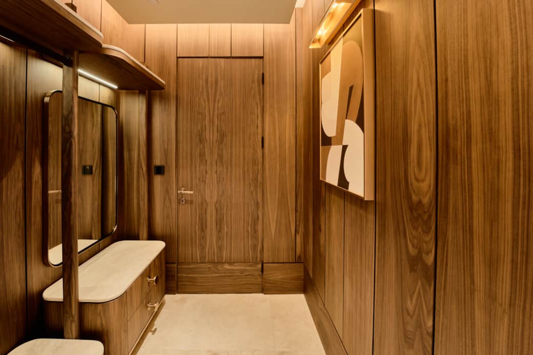 Elegant entrance with wood finishes and soft lighting.