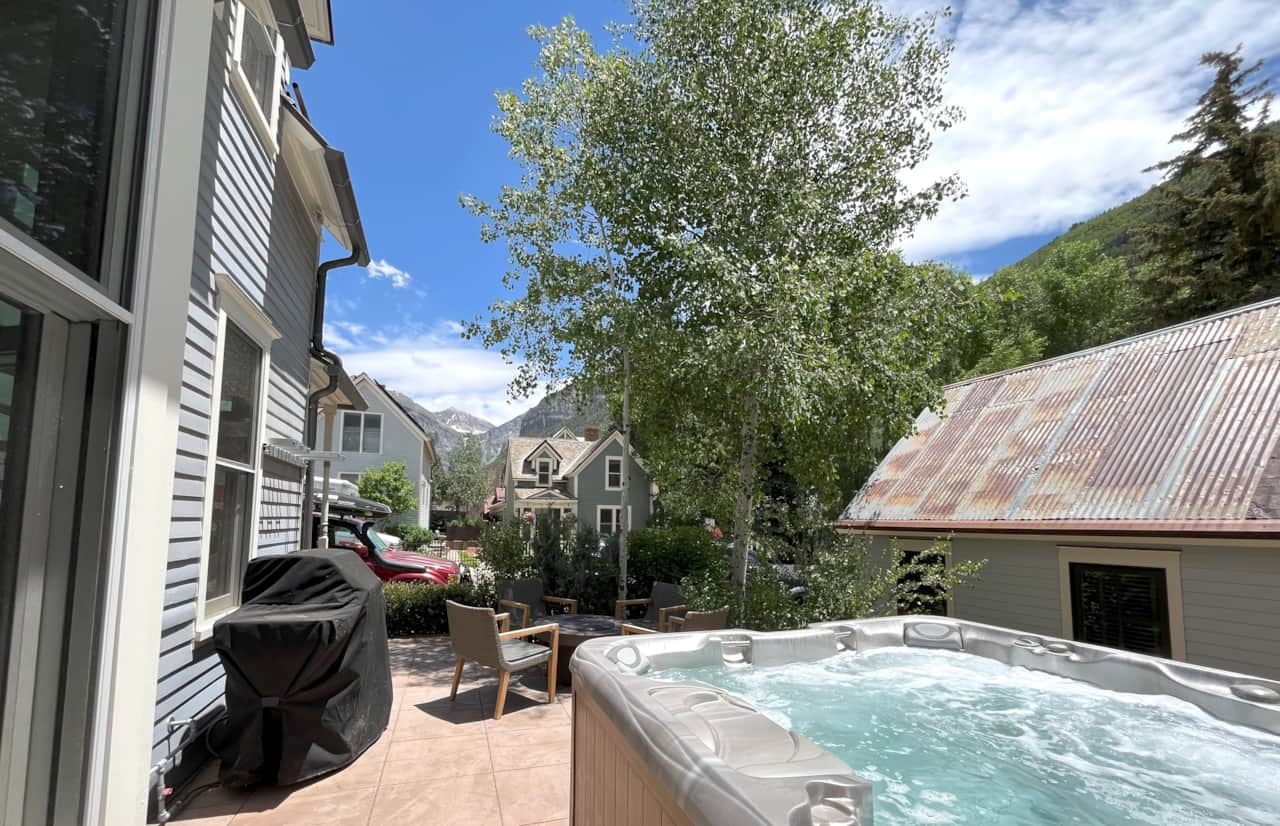 Private back patio oasis with private outdoor hot tub, grill and firepit - perfect for hanging out!