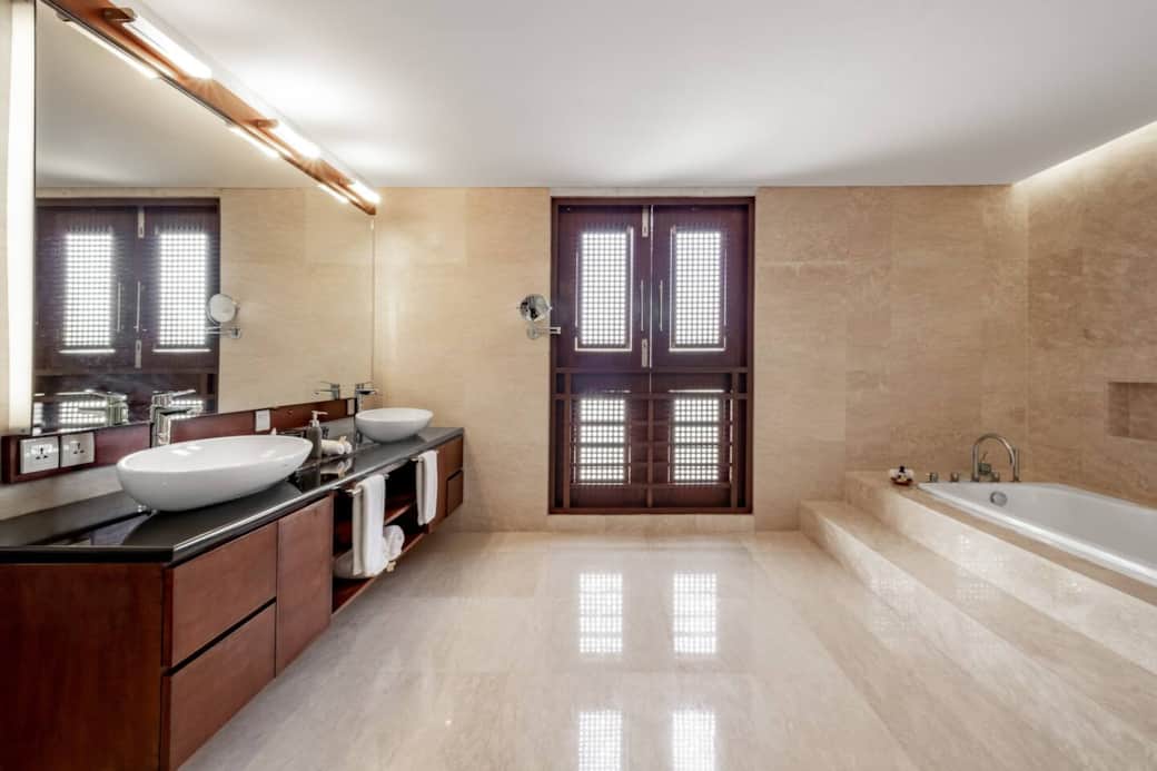 Master bedroom luxurious marble bathroom with bathtub and stand alone shower