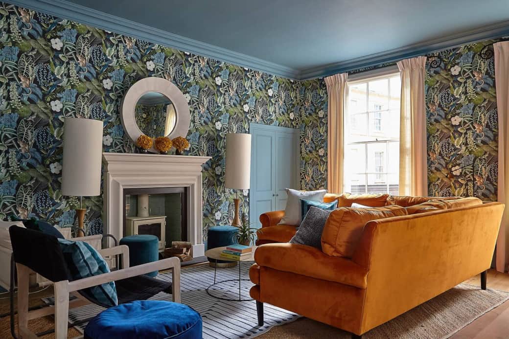 Spacious living room with velvet corner sofa and huge flatscreen tv Spacious living room with velvet corner sofa and huge flatscreen tv