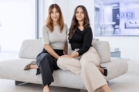 RENTAL12 co-founders Floriana Panvini Rosati and Kristina seated on the sofa at the Olbia office