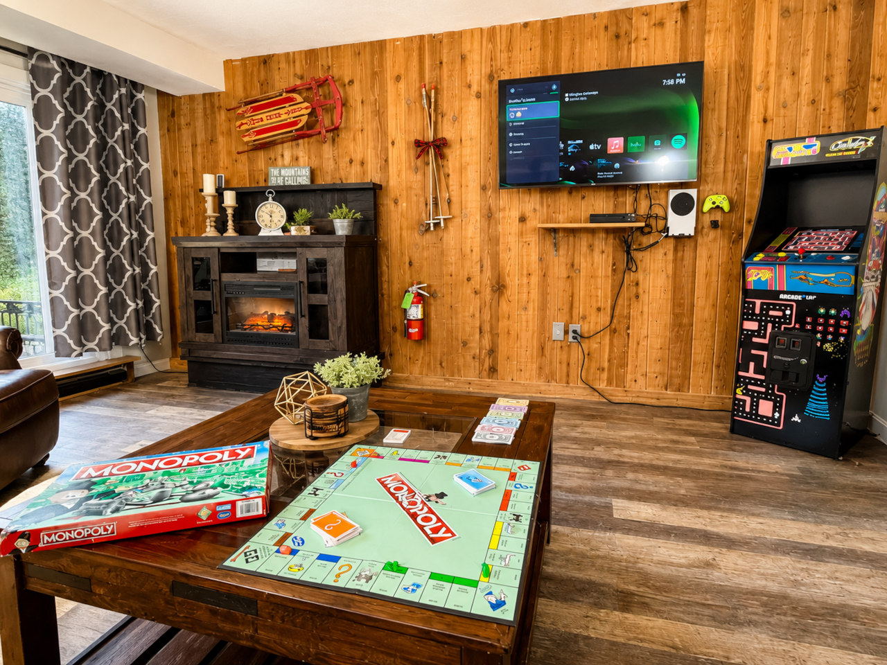 Unwind by the electric fireplace after a day of adventure...or settle the rivalry with Ms Pac Man!