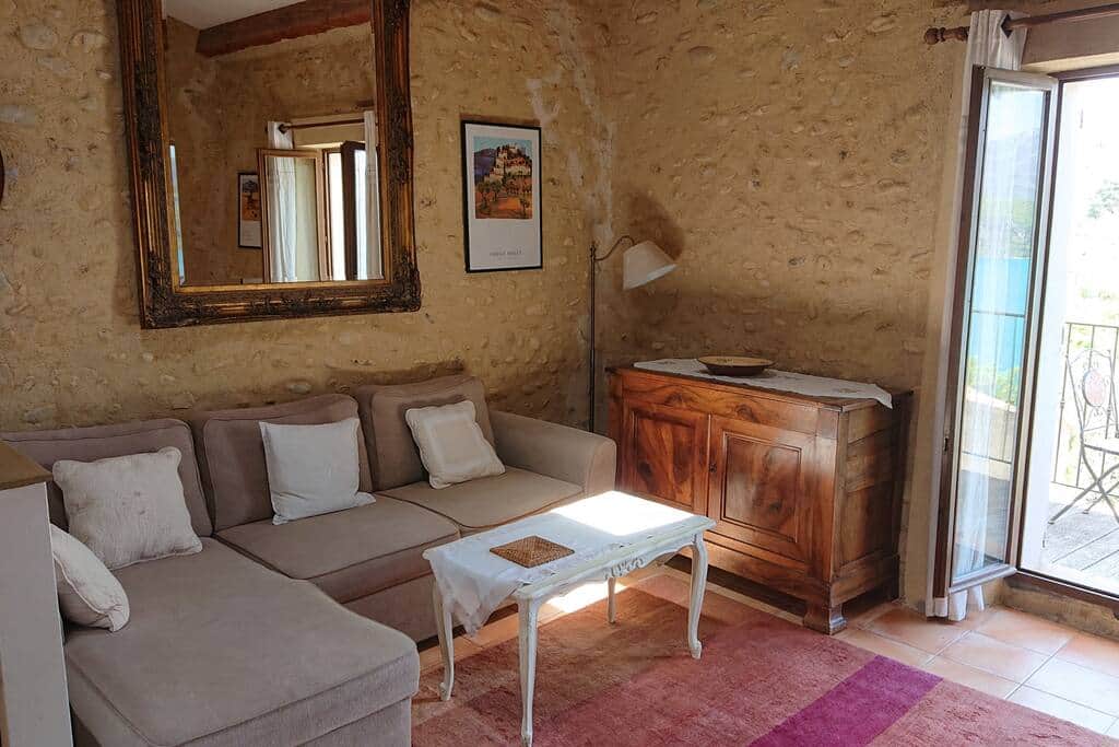 Charming interior with exposed beams and stone walls