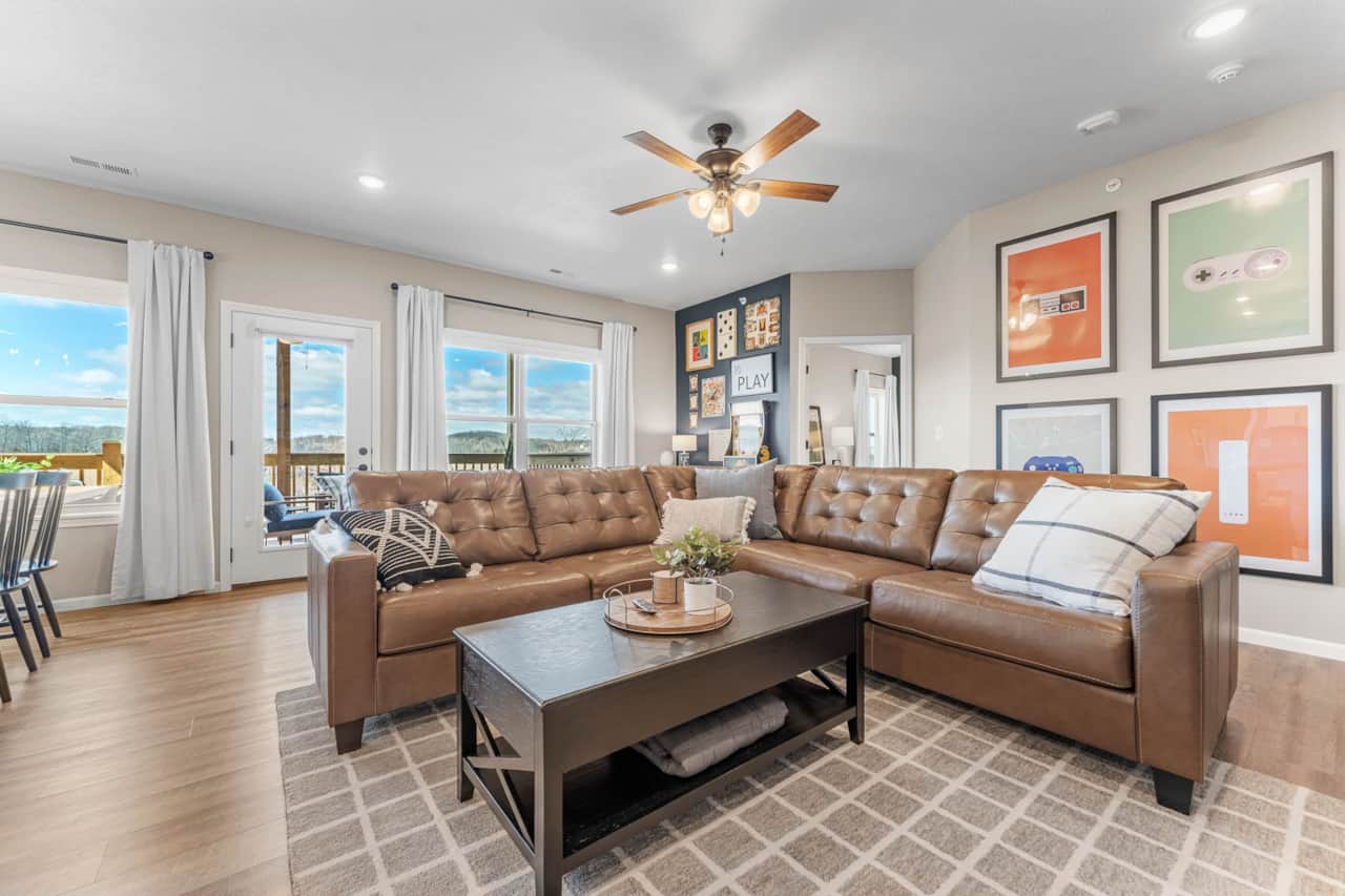 Spacious living room area with leather sectional