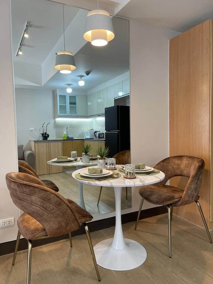 Two delightful dining chairs that are cozy and inviting.