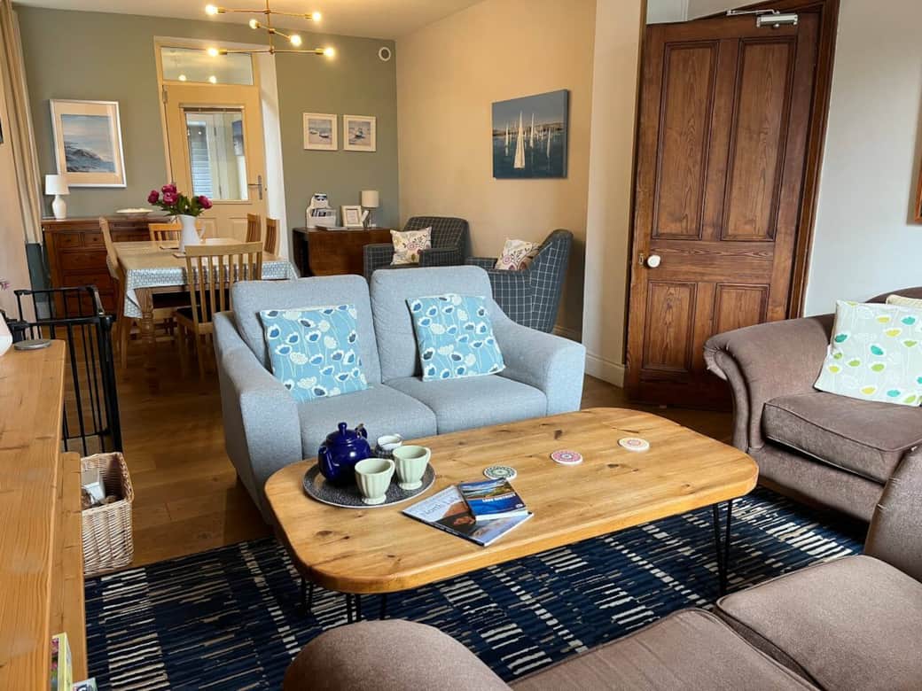 The living room has 3 two seater sofas, tv, underfloor heating, wood burner stove and a selection of books and games. 
A starter amount of wood is supplied for the stove.  