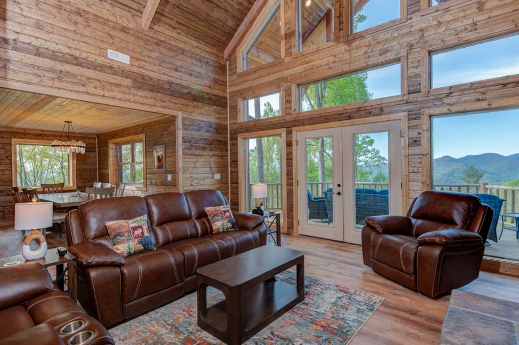 Majestic great room featuring outdoor porch with sweeping mountain panorama beyond