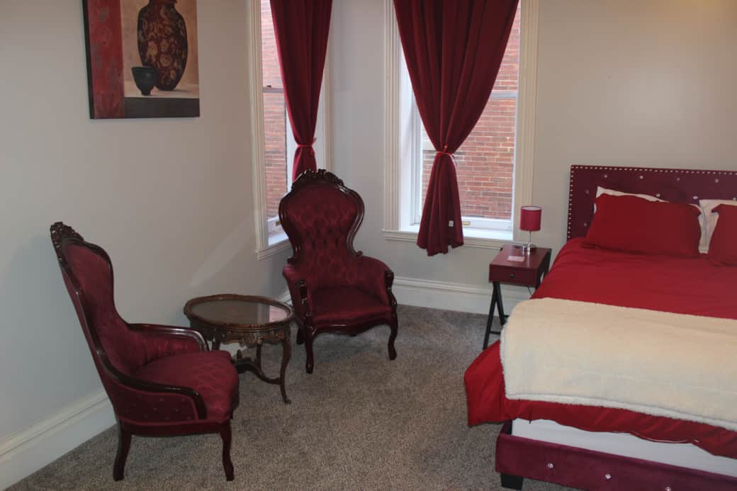 Burgundy Bed & Sitting area