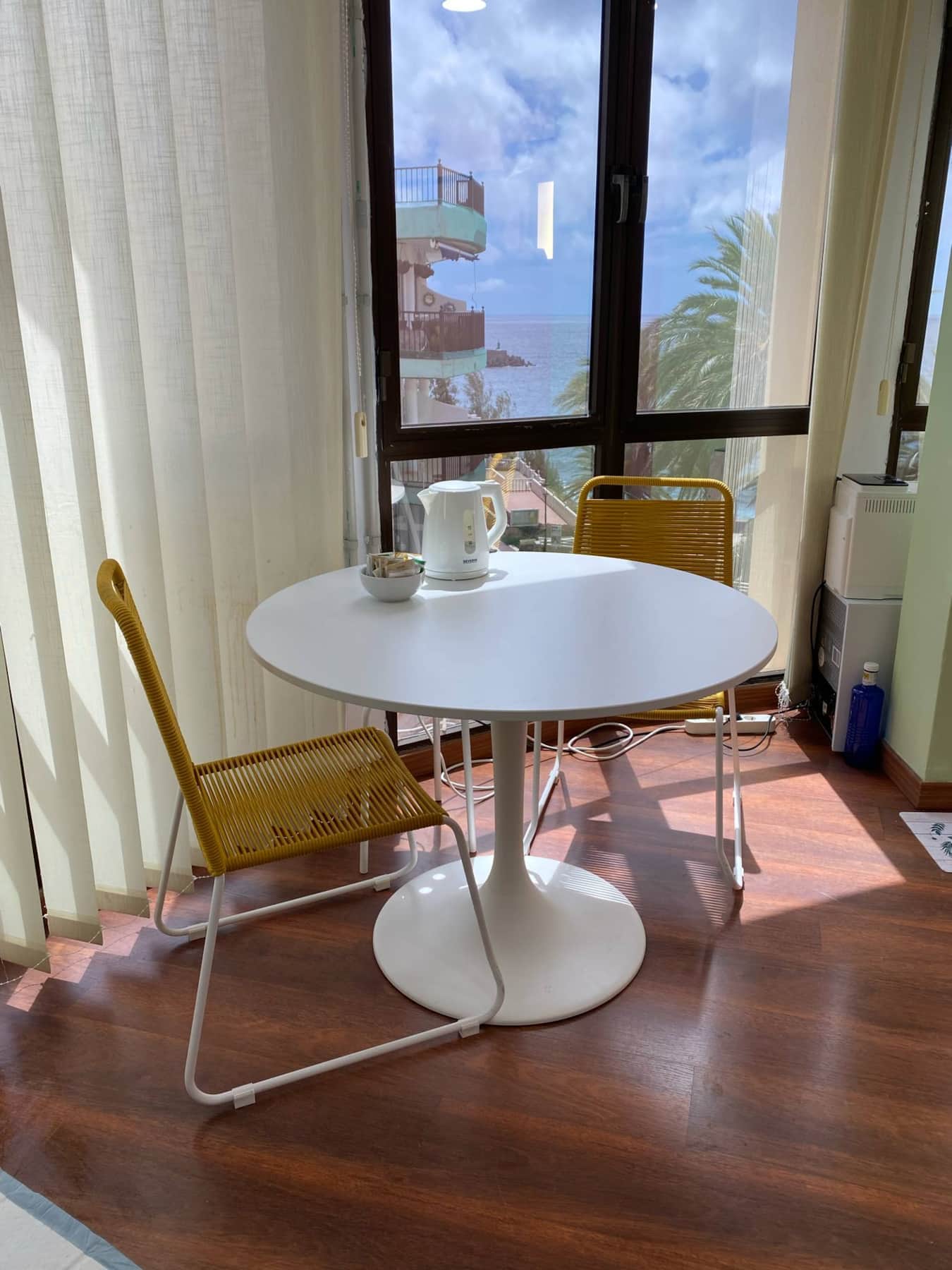 Have a coffee break and enjoy the view of the palms and the ocean.