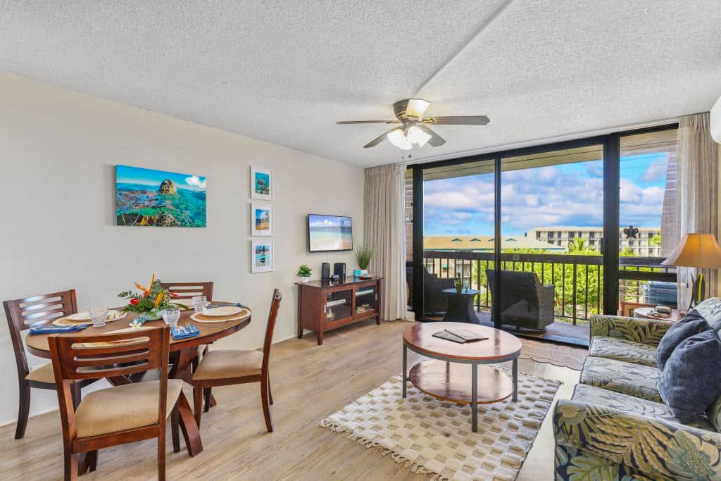 Dining area and living room have a killer view of resort and ocean. 