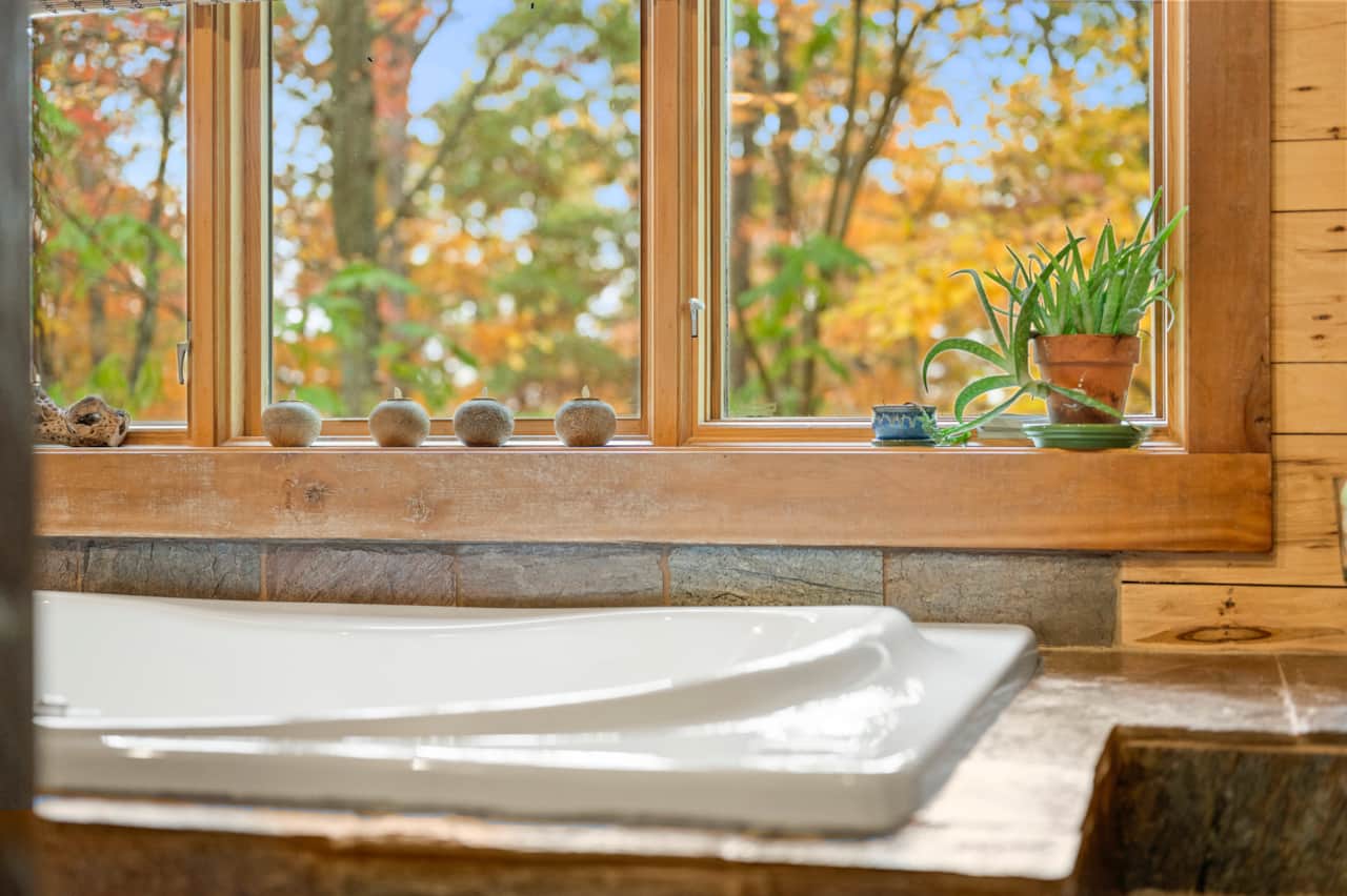 Jacuzzi Window View of the tree tops, sunsets, and Lake Lemon.