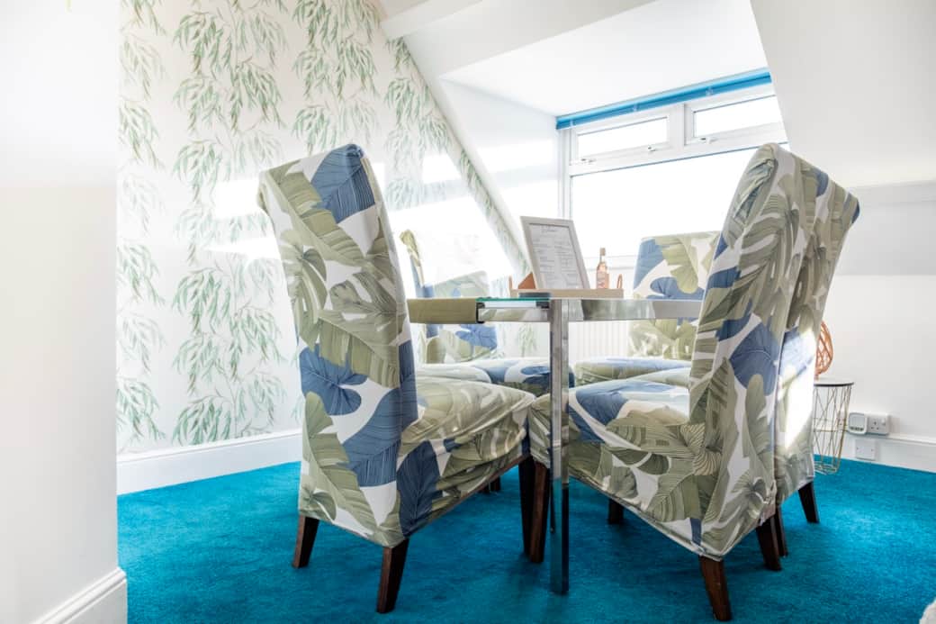 Elegant dining space for four, ideal for relaxed meals, morning coffee, or evening drinks.” Elegant dining space for four, ideal for relaxed meals, morning coffee, or evening drinks.”