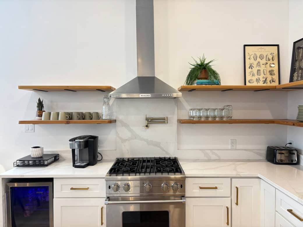 Channel your inner chef in this massive quartz kitchen with high-end chef appliances (Viking range)