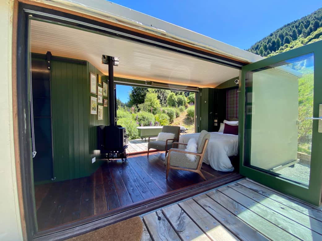 Lounge/Bedroom with doors wide open to the deck