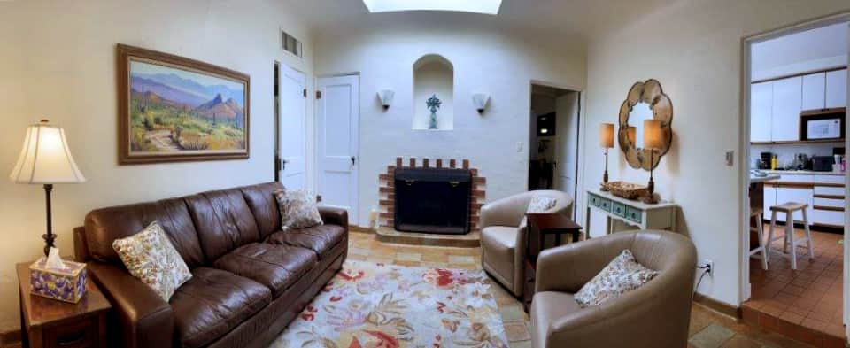 Guests can relax and enjoy this cozy den features natural lighting and cozy details.