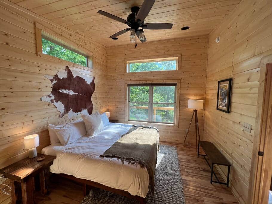 First primary bedroom with luxe king bed and ensuite bathroom