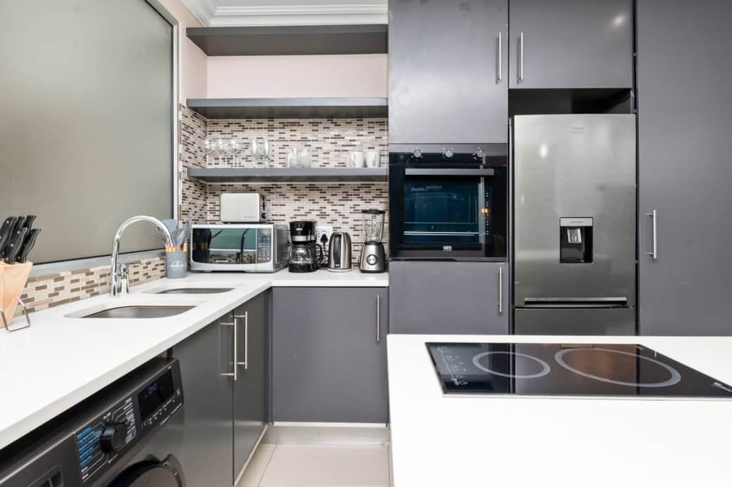 Self-Catering Sanctuary: Unleash your inner chef in our sleek, fully-equipped kitchen, featuring a coffee maker for the perfect morning coffee & an efficient 2-burner induction cooktop, perfect for quick breakfasts or indulgent dinners.
